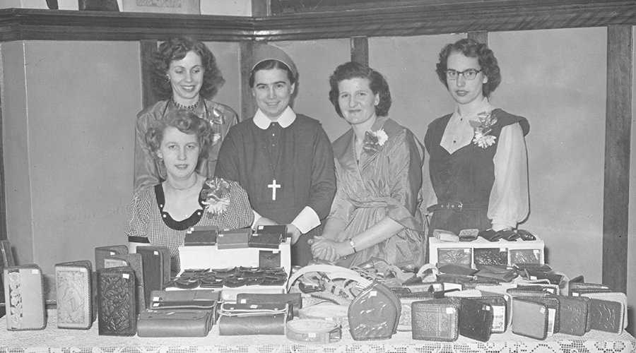 Residents with a leather craft display