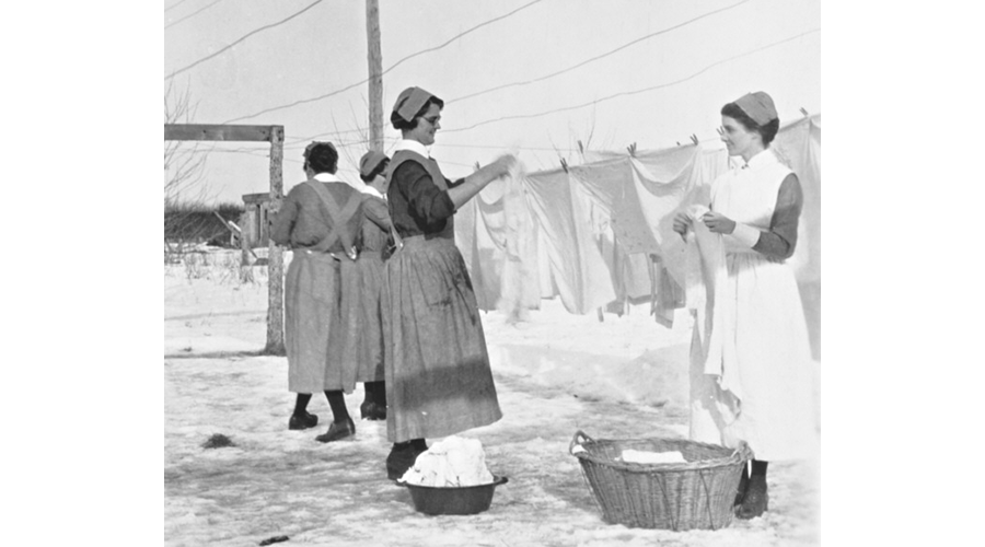 Sisters hang laundry