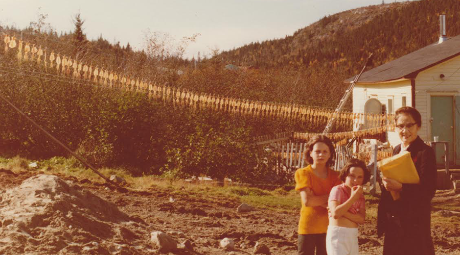 Sister Barton with students and drying squid