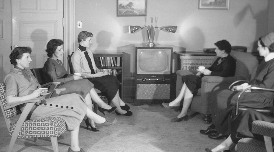 Sister Sullivan and residents watch television
