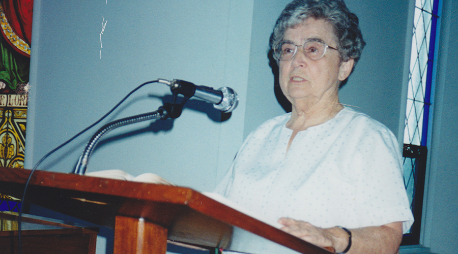 Sister Anstett reads at Mass