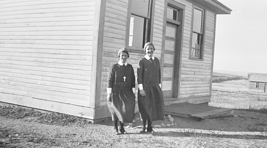 Sisters Morgan and Jackson outside a school