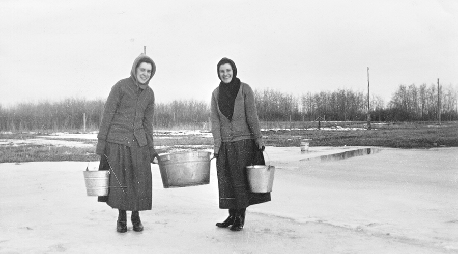 Sisters Roberts and Mossey with water pails