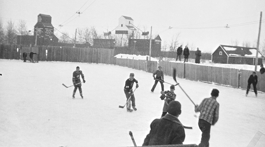 Students play hockey outdoors