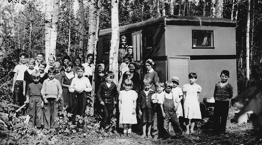 Sister Irene Faye with families at campsite
