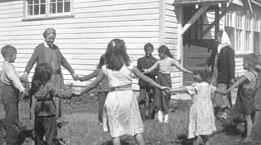 Sister Agnes Brunning plays with students